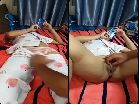 Husband plays with his beloved wife's braid while she is busy hunting for a sale